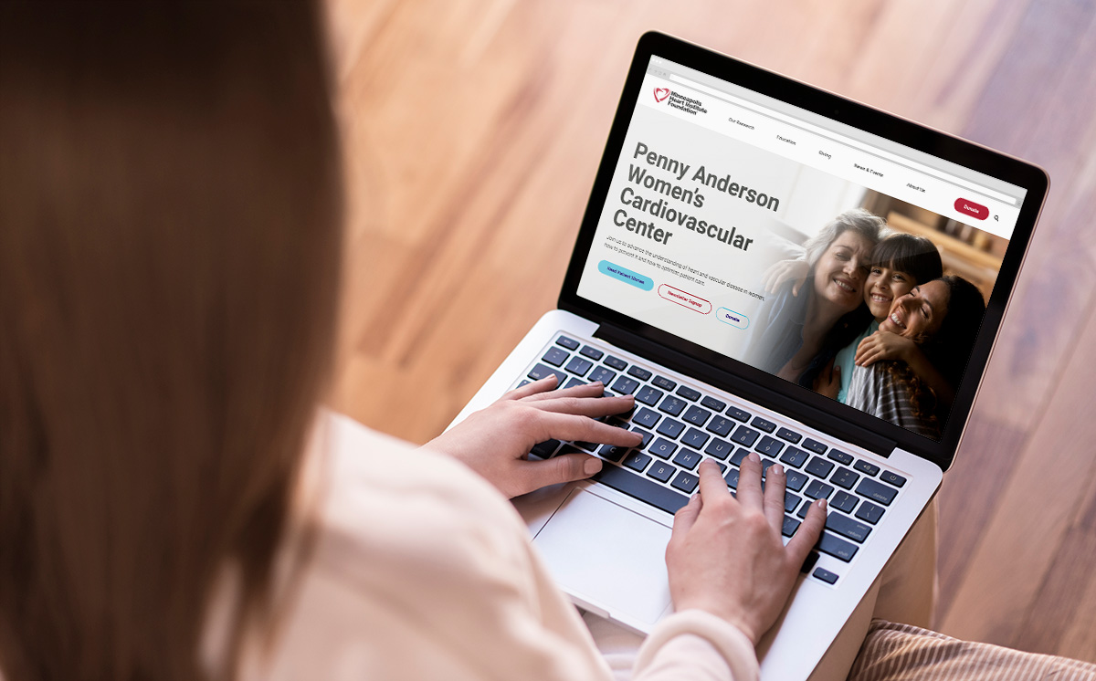 Woman using laptop with MHIF website